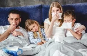 Sick family on bed