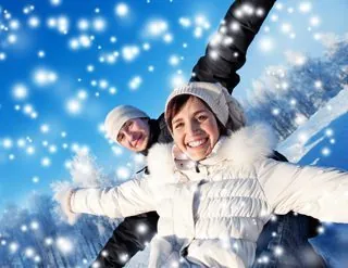 Happy smiling couple on a winter background