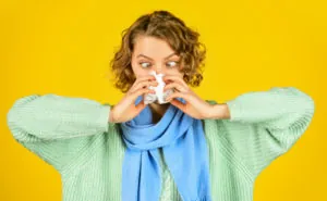 Cold flu symptoms. Sick woman blowing nose. Chronic sinusitis. Contagious respiratory disease. Influenza infection. Sinusitis treatment. Sinusitis diagnostics. Inflammation of nasal sinus. Runny nose
