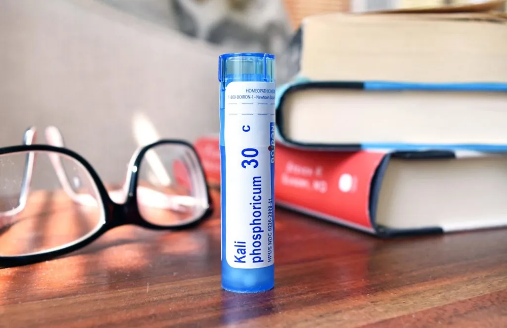 Blog: Kali phos on table with reading glasses and stack of books